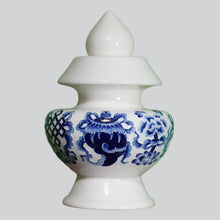 Blue Eight Auspicious Symbols relief on White Treasure Vase