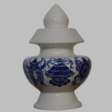 Blue Eight Auspicious Symbols relief on White Treasure Vase