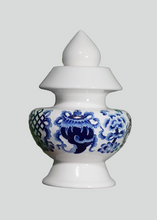 Blue Eight Auspicious Symbols relief on White Treasure Vase